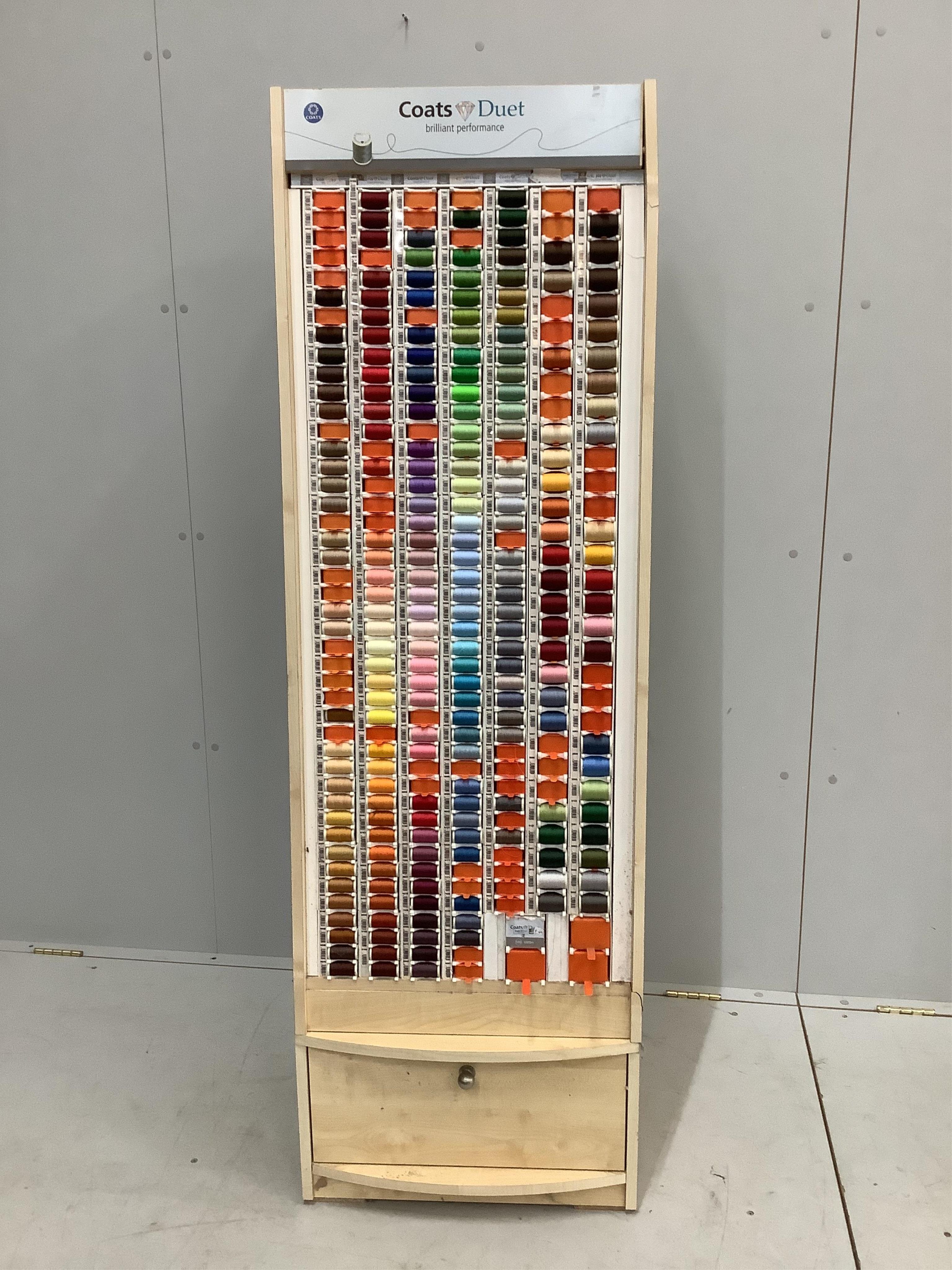 A ‘Coats Duet’ haberdasher's shop thread display unit with a quantity of assorted spools, width 51cm, depth 40cm, height 162cm. Condition - good
